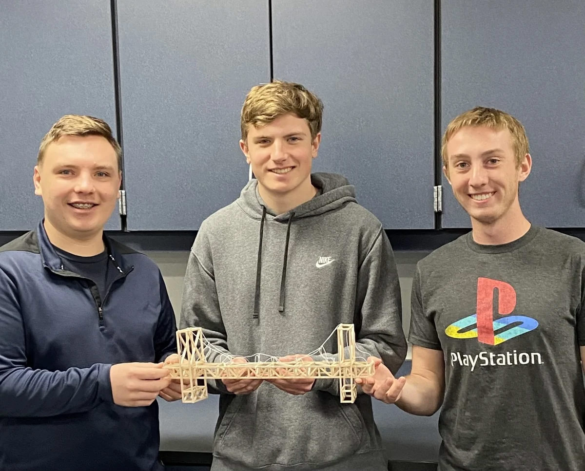 boys showing their bridge design