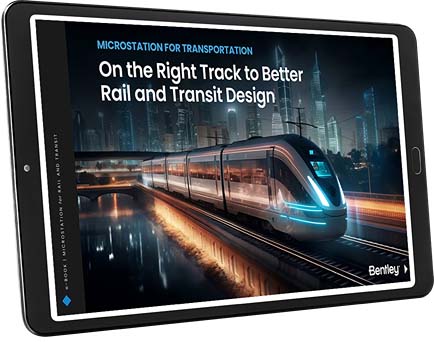 A tablet displaying an advertisement for "MicroStation for Transportation" focuses on improved rail and transit design, featuring an image of a modern train on tracks in an urban setting, highlighting better infrastructure. | Bentley Systems | Infrastructure Engineering Software Company A tablet displaying an advertisement for "MicroStation for Transportation" focuses on improved rail and transit design, featuring an image of a modern train on tracks in an urban setting, highlighting better infrastructure.