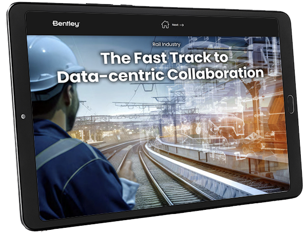 Worker viewing a digital presentation on the tablet about data-centric collaboration in the rail industry through Discover ProjectWise. | Bentley Systems | Infrastructure Engineering Software Company Worker viewing a digital presentation on the tablet about data-centric collaboration in the rail industry through Discover ProjectWise.